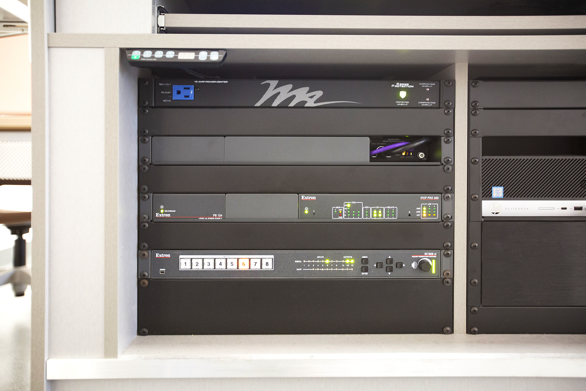 Spaces such as the active learning classrooms and various meeting rooms include an Extron presentation switcher in a local rack.