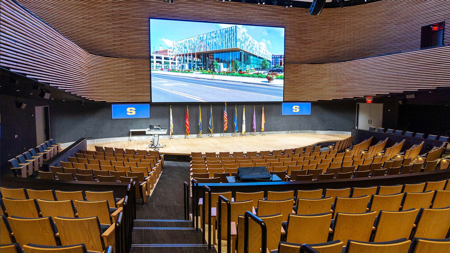 During the pandemic, the K. G. Tan Auditorium was used for lectures to ensure appropriate spacing between students, with a standardized instructor workstation taking the place of the portable lectern on the stage.