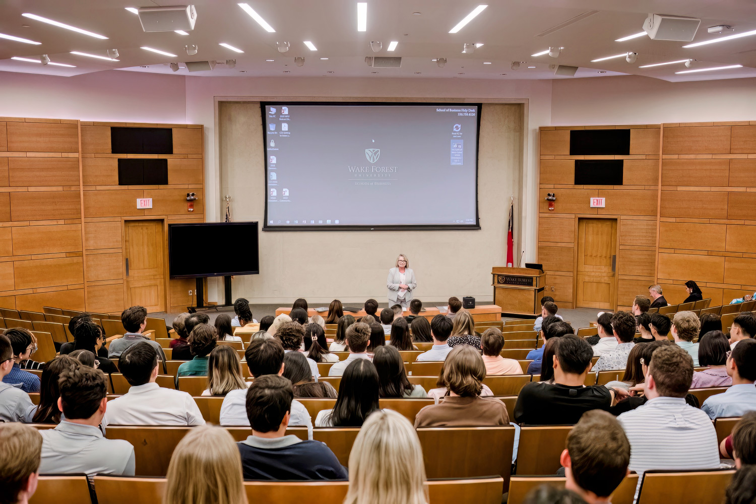 Lecturer using the AV amenities in the Broyhill Auditorium.