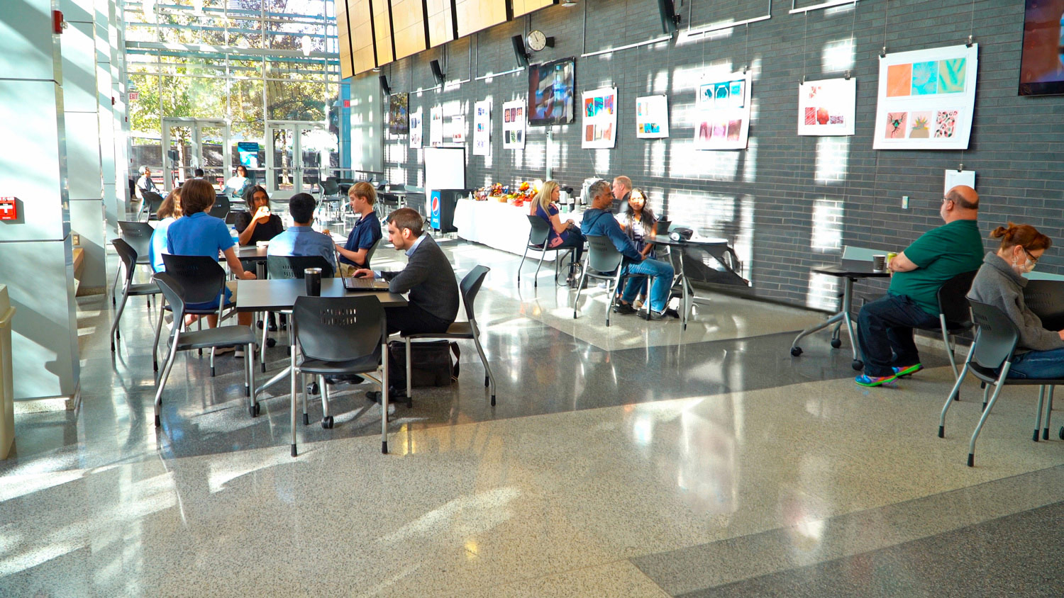 The atrium located adjacent to the lecture hall can be used as an extension of the lecture hall for prestaging performances or to accommodate overflow audiences. It also functions as a venue to host college and community events with or without food service. It is equipped with flat panel displays, speakers, and HDMI connection ports that link to the lecture hall AV system.