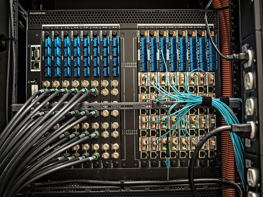 The XTP II CrossPoint 32x32 matrix switcher is configured to support 3G-SDI source video, and convert these signals for long distance transmission over fiber to HDMI displays.