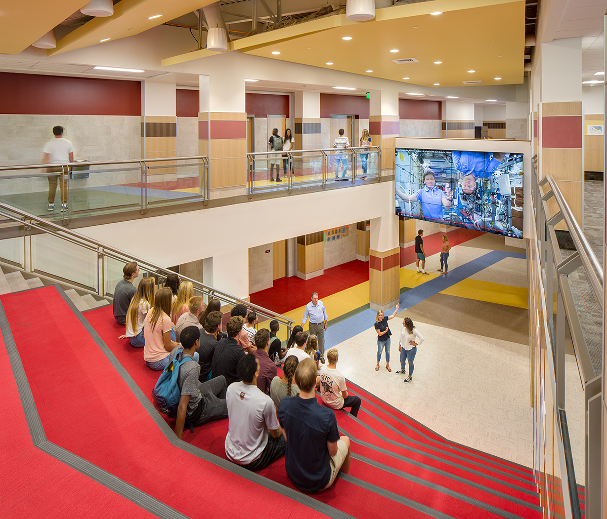 Students viewing a presentation shown on a flat panel display