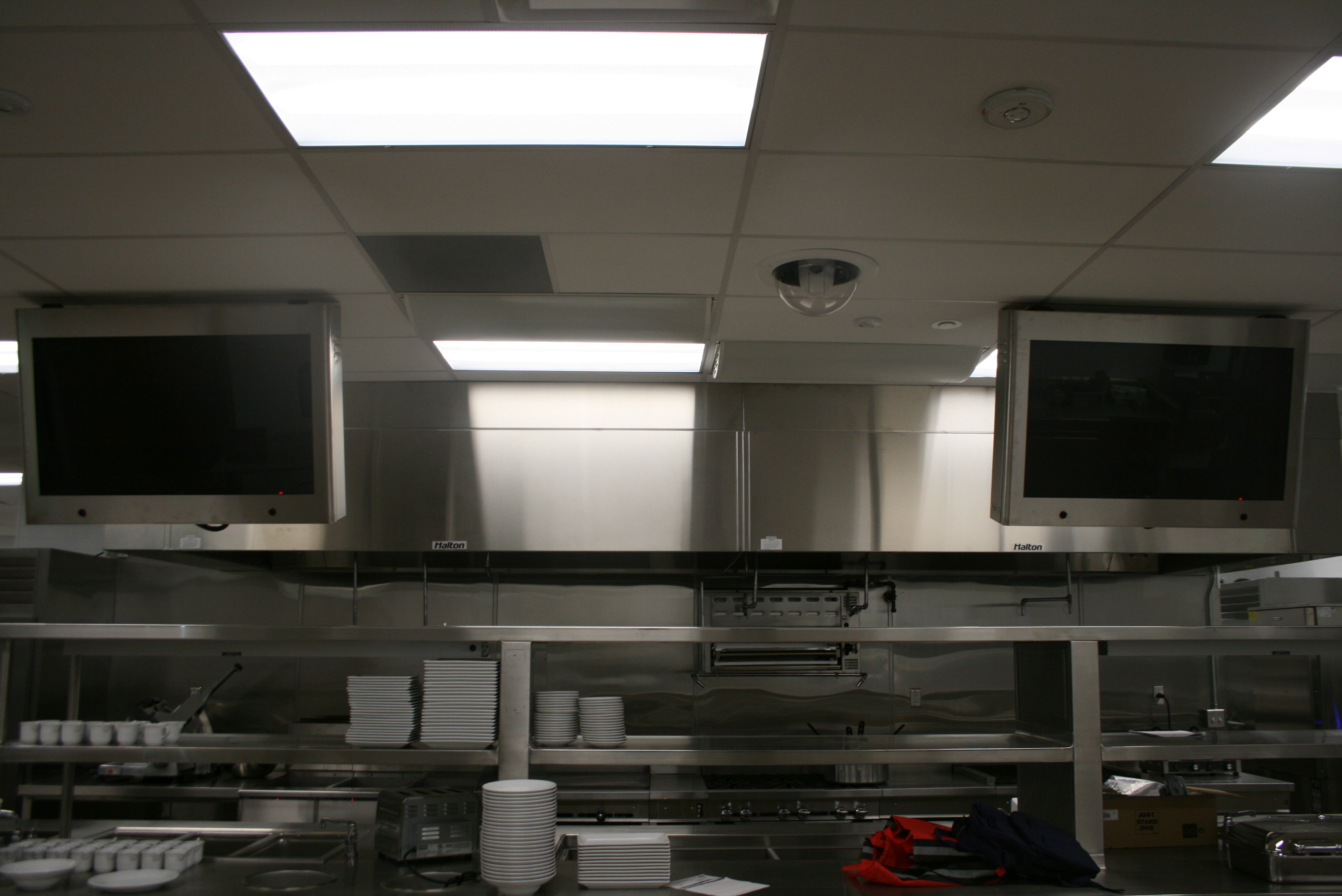 Flat panel displays mounted above each serving station