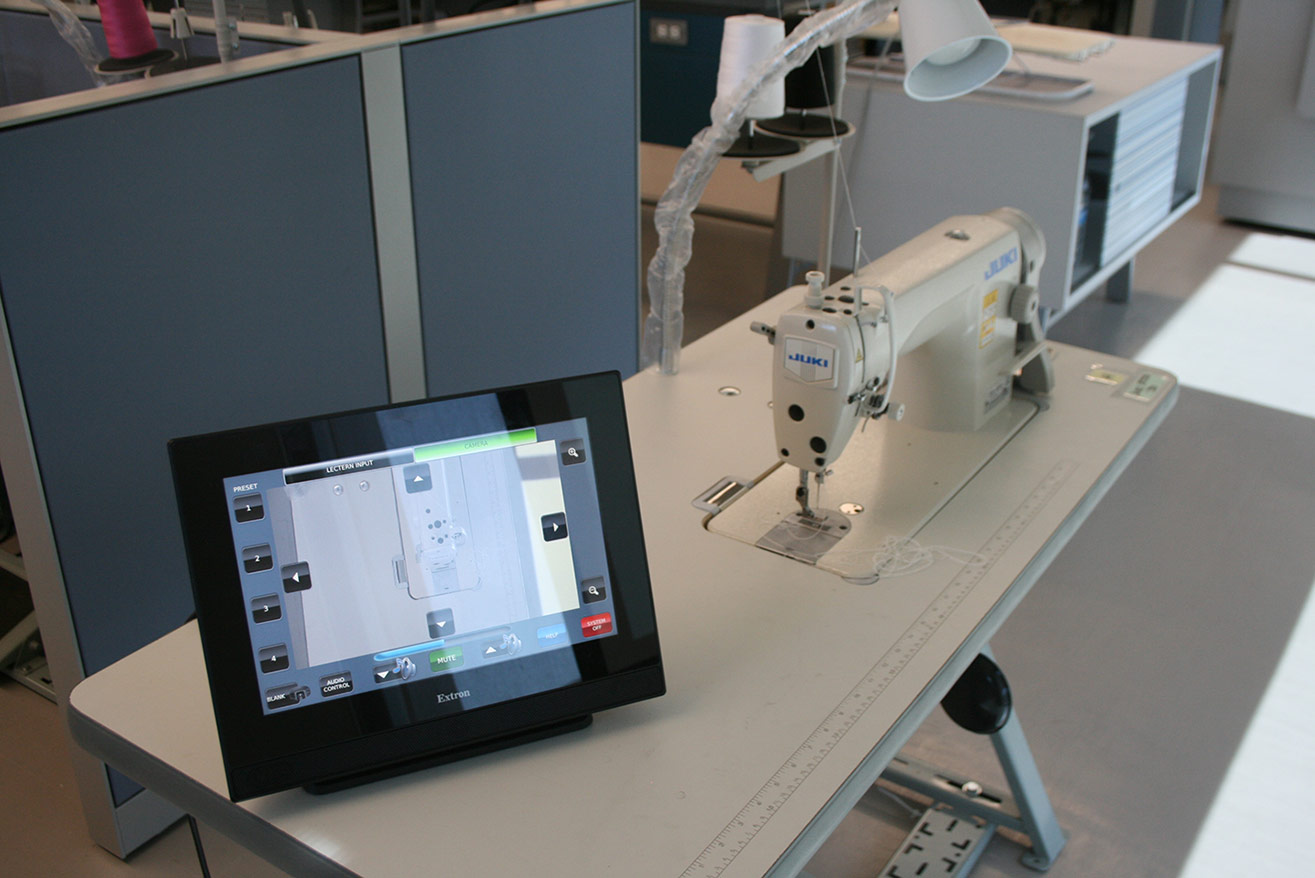 Control system placed on top of sewing machine desk