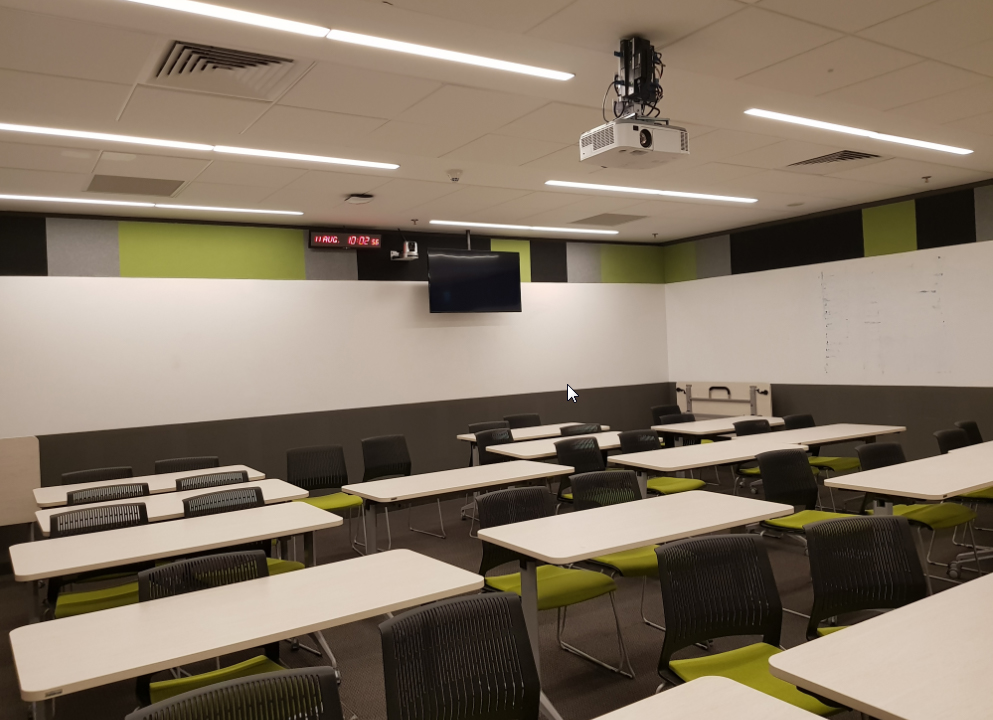 Classroom with a projection system and flat panel display