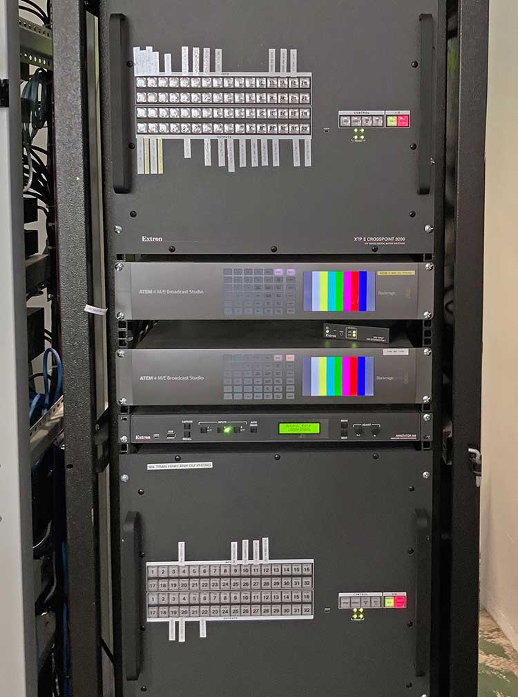 Auditorium AV equipment rack housing two XTP II CrossPoint 3200 Matrix Switchers.