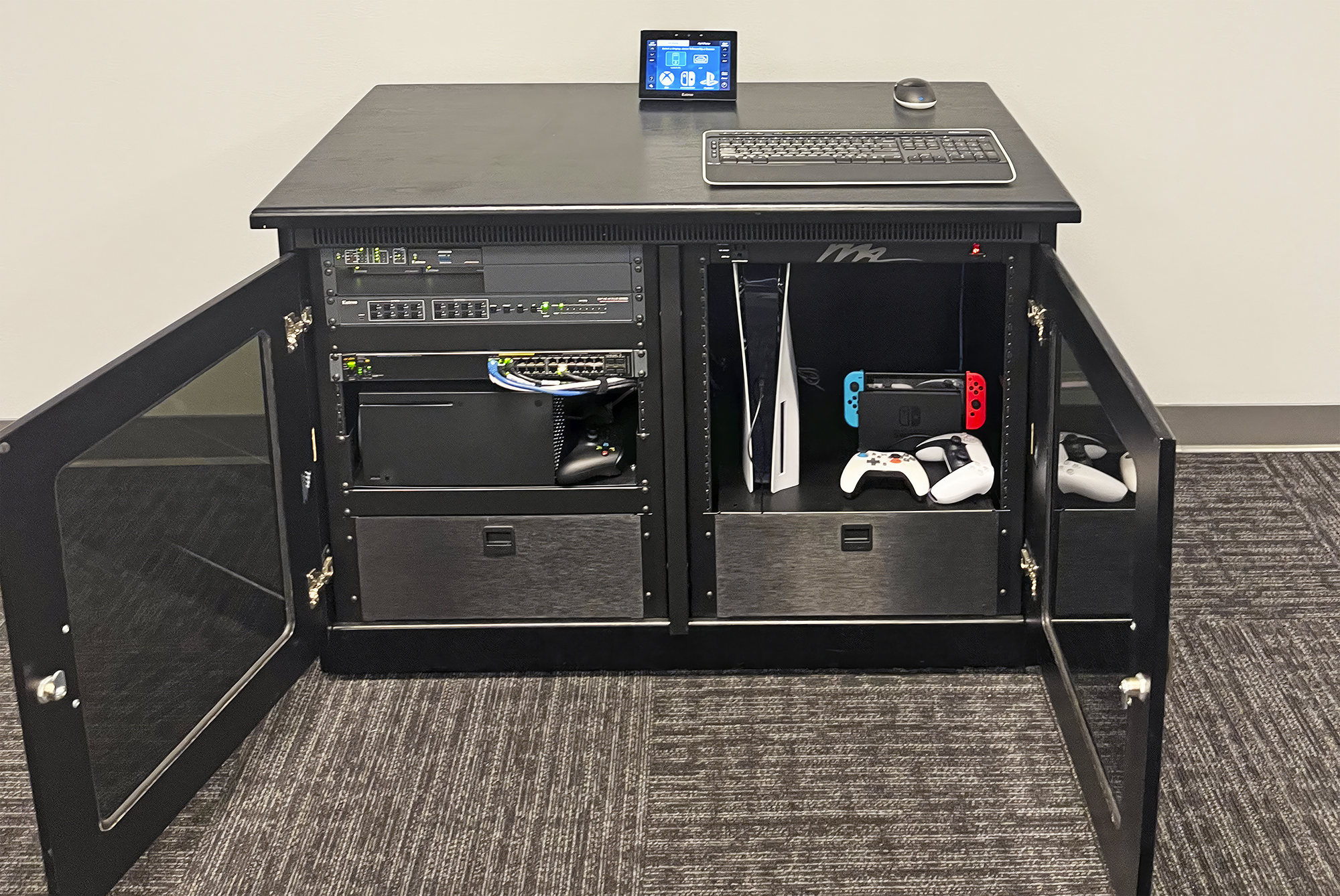 A credenza in the spectator lounge houses the main AV equipment.