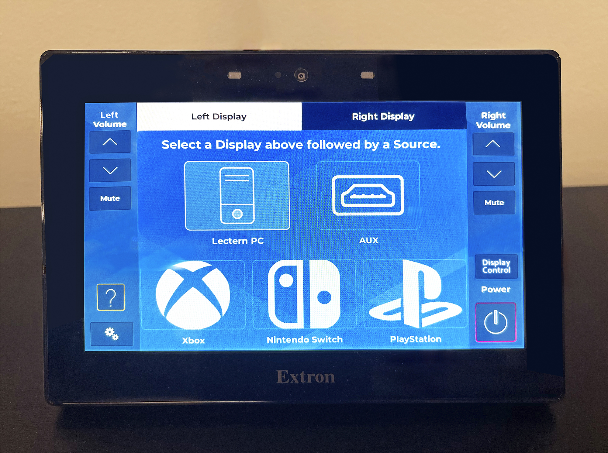 A TouchLink Pro touchpanel on top of the credenza controls routing of the gaming content through the AV system.