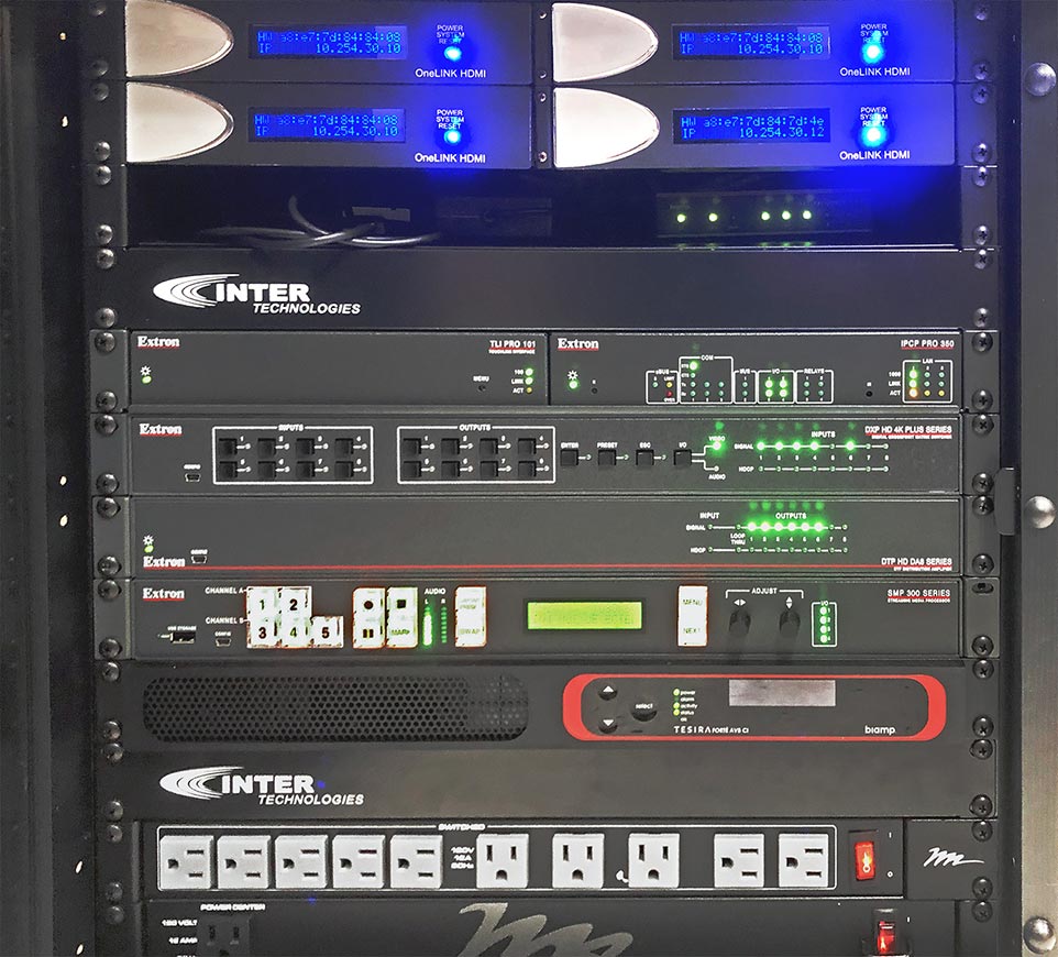 AV equipment rack fits into the tight space below the control room instructor desk.