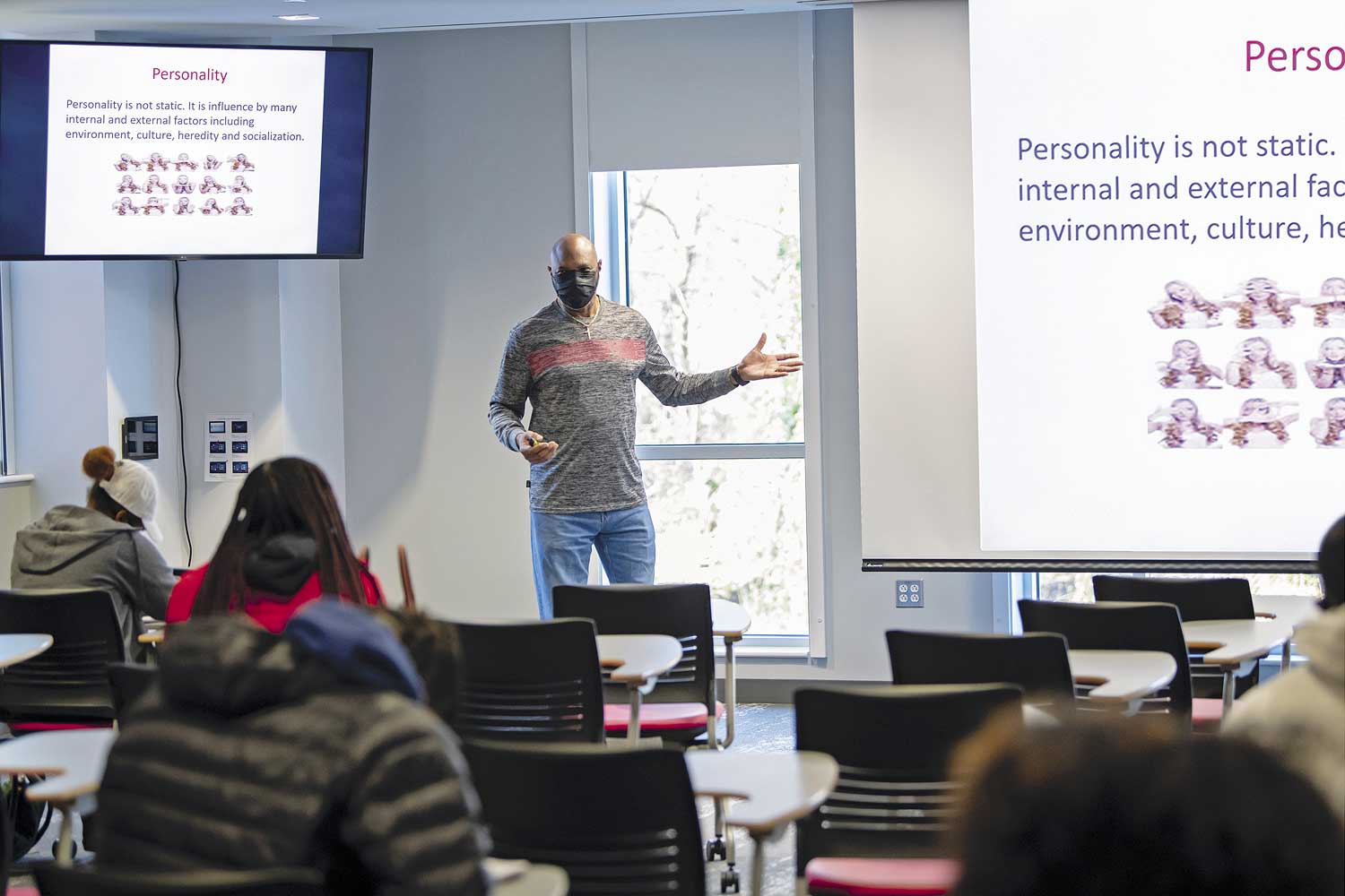 Popular Health Science and Cell Biology courses are taught in large classrooms with multiple AV displays. Health Science class session is shown here.