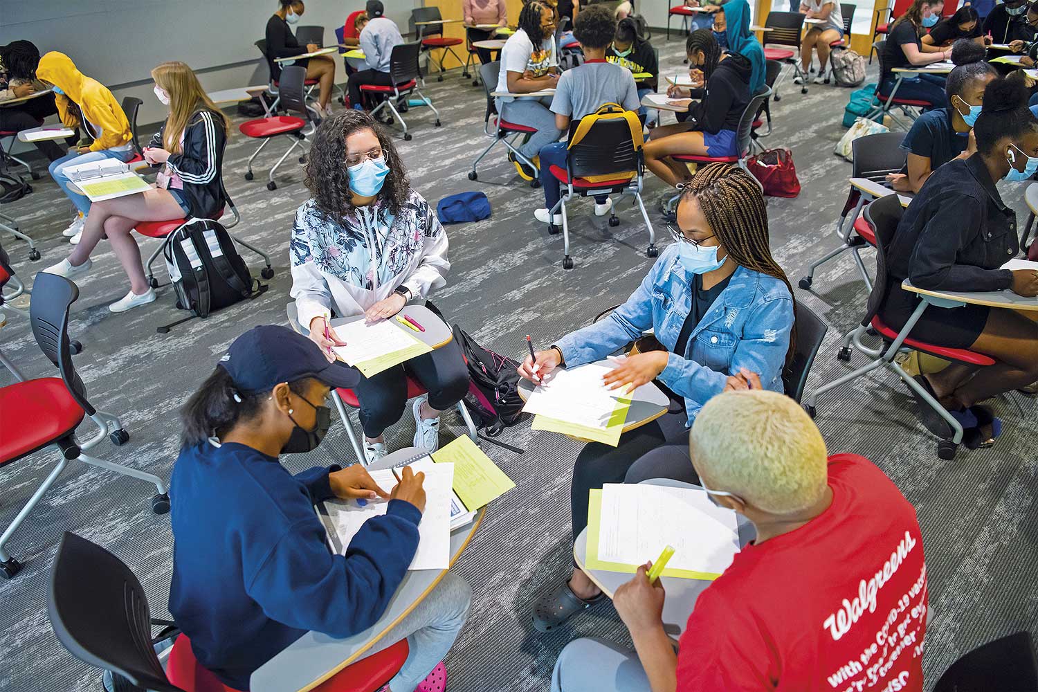 Mobile desks allow students to form ad hoc collaboration pods around the displays in the large classrooms, which are equipped with multiple displays.