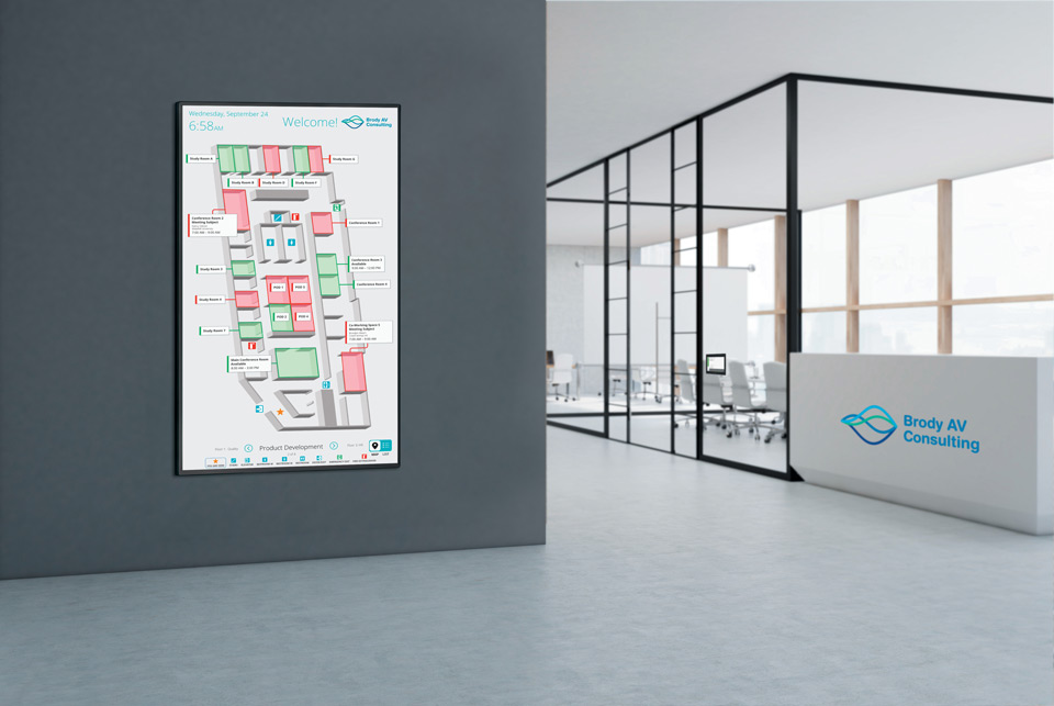 Extron Room Scheduling panel in an interactive map view placed on an office wall (portrait layout).