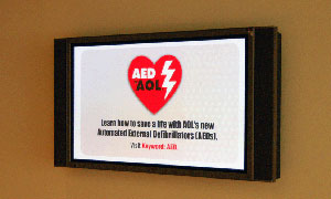 Two of the 10 " digital signs " placed within the six-building AOL campus display a wide variety of informative and colorful content.