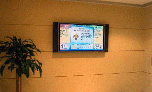 Two of the 10 " digital signs " placed within the six-building AOL campus display a wide variety of informative and colorful content.