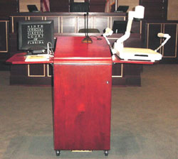 The evidence presentation system is located on a podium.